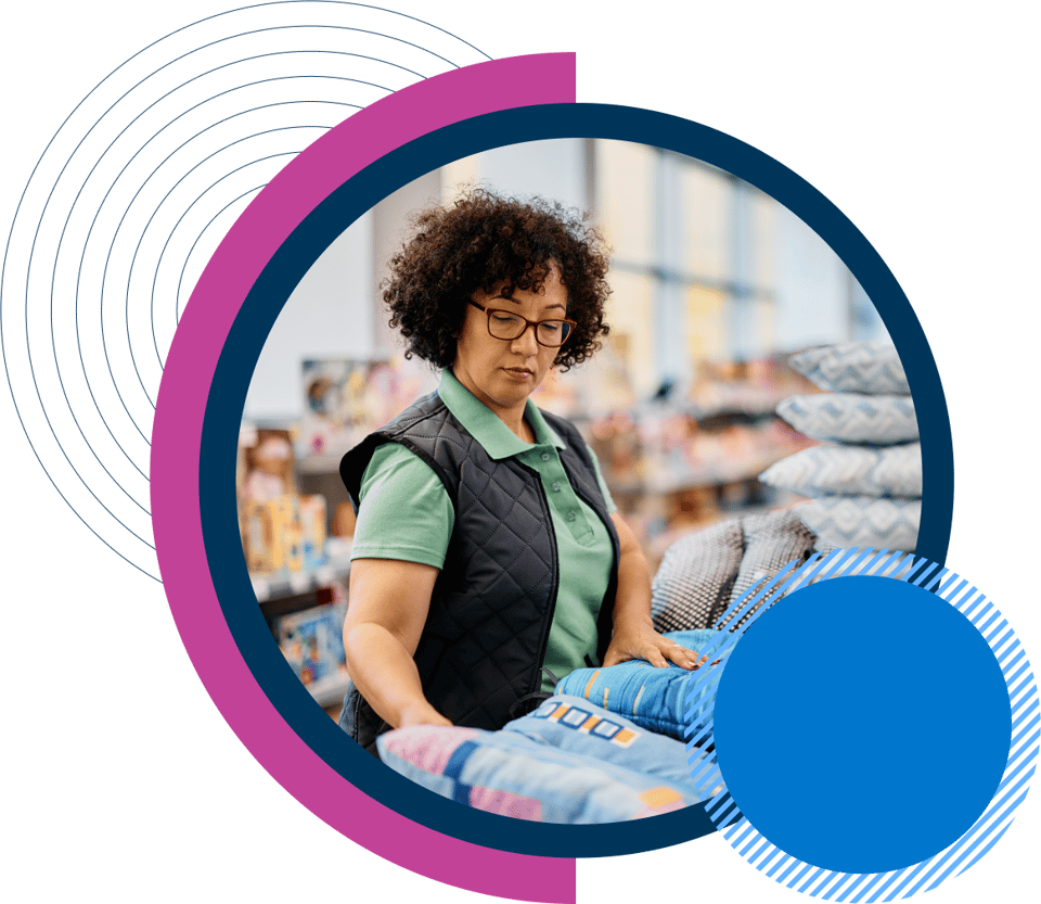 Woman folding clothes in store