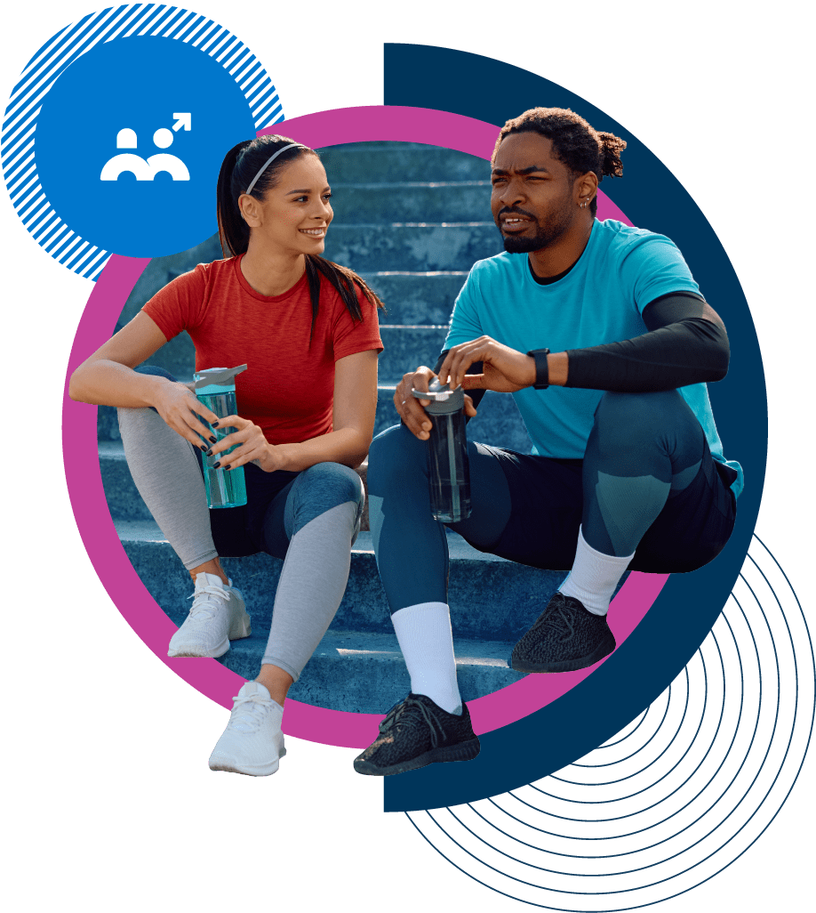 Two runners sitting on steps chatting