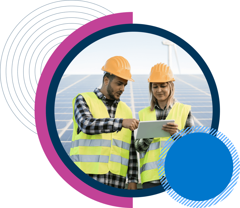 Man and women in front of solar panels