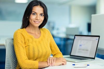 Corporate women sitting with a laptop