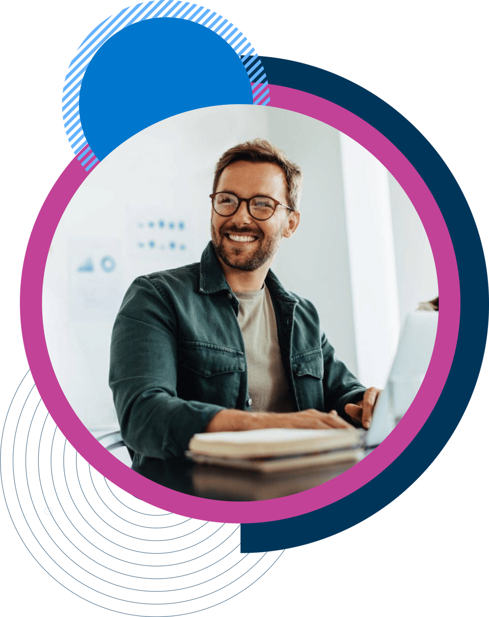 Man working on laptop smiling