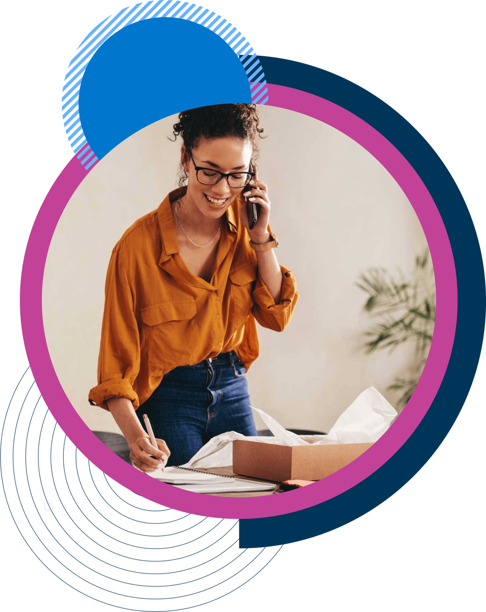 Woman on phone writing down notes