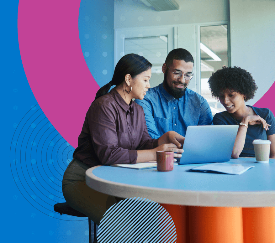 The ultimate guide to learning platforms - A team of three employees working together on a laptop