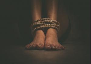 person's fee bound with rope