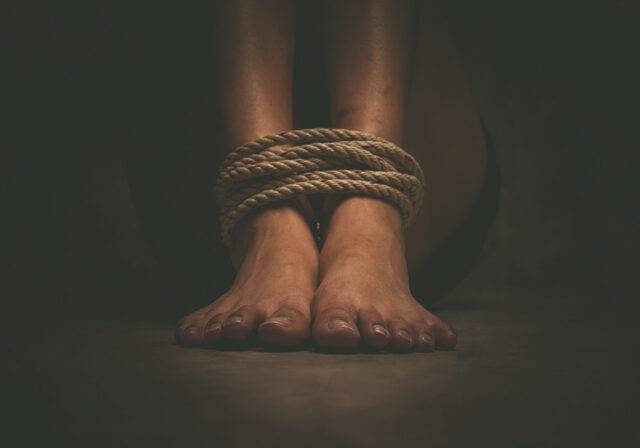 person's fee bound with rope